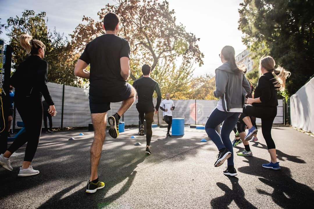 Athletes training hard together as part of gym member retention strategies