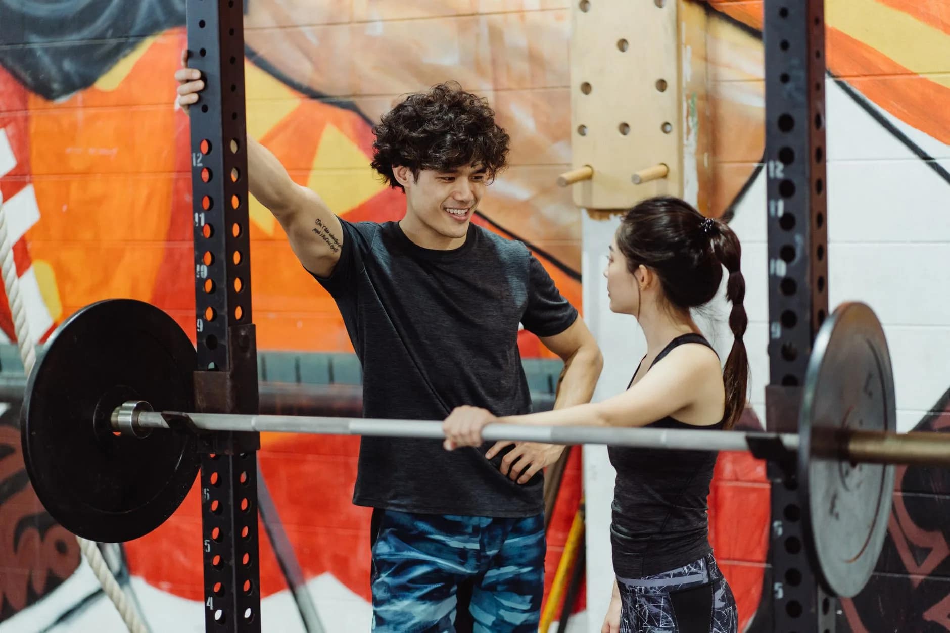 A gym owner having a retention conversation with a member to reduce gym churn